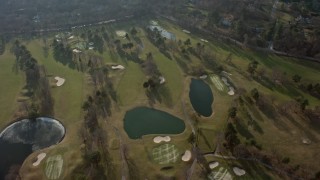 5K aerial stock footage of a bird's eye view of Tam O'Shanter Golf Club in Brookville, Long Island, New York, winter Aerial Stock Footage | AX0065_0017