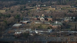 AX0065_0020E - 5K aerial stock footage of library at LIU Post in Brookville, Long Island, New York, winter