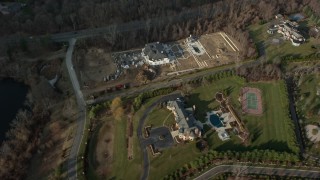 5K aerial stock footage tilt and pass by large mansions in Greenvale, Long Island, New York, winter Aerial Stock Footage | AX0065_0022