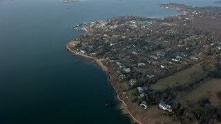 5K aerial stock footage of upscale, waterfront homes by Little Neck Bay in Great Neck, Long Island, New York, winter Aerial Stock Footage | AX0065_0027E