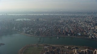 5K aerial stock footage approach public housing, urban neighborhoods, and Central Park, Upper East Side, Harlem, New York City, winter Aerial Stock Footage | AX0065_0042