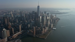 5K aerial stock footage of Freedom Tower and skyscrapers at the World Trade Center, Lower Manhattan, New York City, winter Aerial Stock Footage | AX0065_0066E