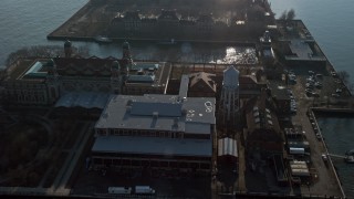 5K aerial stock footage approach and fly over the Immigrant Building on Ellis Island, New York, winter Aerial Stock Footage | AX0065_0075