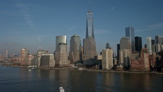 AX0065_0087E - 5K aerial stock footage of Freedom Tower and the skyline of the World Trade Center in Lower Manhattan, New York City, winter