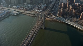 5K aerial stock footage of heavy traffic leaving Lower Manhattan on the Brooklyn Bridge, New York City, winter Aerial Stock Footage | AX0065_0105