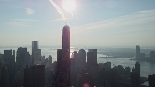 5K aerial stock footage of One World Trade Center towering over Lower Manhattan high-rises and skyscrapers, New York City, winter Aerial Stock Footage | AX0065_0108E