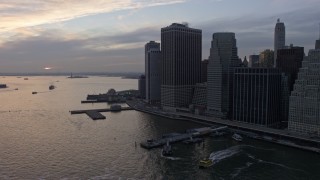 5K aerial stock footage flyby riverfront skyscrapers and piers in Lower Manhattan, New York City, winter, twilight Aerial Stock Footage | AX0065_0180