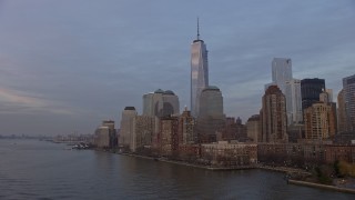 5K aerial stock footage fly low to approach to Freedom Tower and World Trade Center skyline, New York City, winter, sunset Aerial Stock Footage | AX0065_0191E