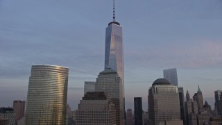 5K aerial stock footage flyby World Trade Center skyscrapers  and tilt to the top of Freedom Tower in New York City, winter, sunset Aerial Stock Footage | AX0065_0194E