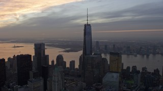 5K aerial stock footage orbit One World Trade Center tower and World Trade Center skyscrapers in Lower Manhattan, New York City, winter, sunset Aerial Stock Footage | AX0065_0199E