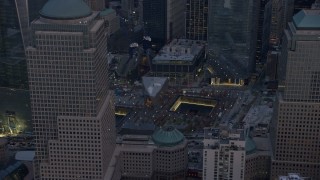 5K aerial stock footage flyby the World Trade Center Memorial in Lower Manhattan, New York City, winter, twilight Aerial Stock Footage | AX0065_0211