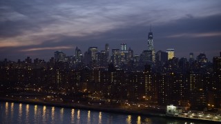 5K aerial stock footage flyby public housing in East Village, with Lower Manhattan skyline in the background, New York City, winter, night Aerial Stock Footage | AX0065_0280