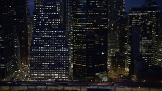 5K aerial stock footage flyby FDR Drive and tall skyscrapers in Lower Manhattan, New York City, winter, night Aerial Stock Footage | AX0065_0283