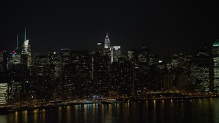 5K aerial stock footage approach the Chrysler Building and Midtown Manhattan skyscrapers, New York City, winter, night Aerial Stock Footage | AX0065_0305