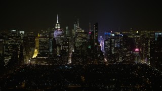 5K aerial stock footage of Midtown Manhattan seen from Central Park, New York City, winter, night Aerial Stock Footage | AX0065_0344E