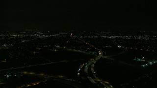 7.6K aerial stock footage approaching the 5 and 170 freeway split at night in Pacoima, California Aerial Stock Footage | AX0156_001