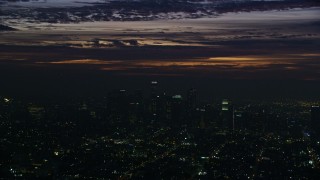 7.6K aerial stock footage of clouds above Downtown Los Angeles skyscrapers at sunrise, California Aerial Stock Footage | AX0156_024E