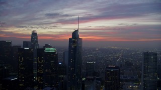 7.6K aerial stock footage flying by Downtown Los Angeles skyscrapers and Wilshire Grand Center at sunrise, California Aerial Stock Footage | AX0156_048E