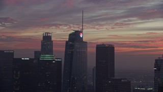 7.6K aerial stock footage of the top of Wilshire Grand Center in Downtown Los Angeles at sunrise, California Aerial Stock Footage | AX0156_056E