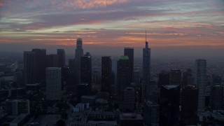 7.6K aerial stock footage flying between skyscrapers in Downtown Los Angeles, California, revealing City Hall early in the morning Aerial Stock Footage | AX0156_075