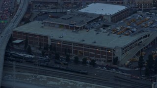 7.6K aerial stock footage of Police Helicopters at LAPD Air Support Division in Downtown Los Angeles, California at sunrise Aerial Stock Footage | AX0156_089