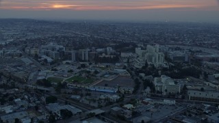 7.6K aerial stock footage of the University of Southern California Health Sciences Campus in Boyle Heights, Los Angeles, California at sunrise Aerial Stock Footage | AX0156_090