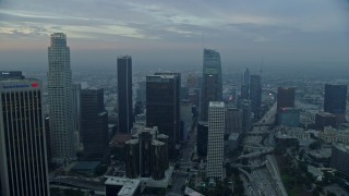 7.6K aerial stock footage of US Bank Tower and skyscrapers in Downtown Los Angeles, California at sunrise Aerial Stock Footage | AX0156_105E