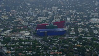 7.6K aerial stock footage of a side view of the MOCA Pacific Design Center, sunrise, Beverly Hills, California Aerial Stock Footage | AX0156_129