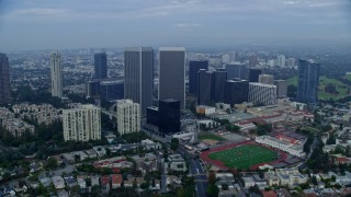 7.6K aerial stock footage of condominiums and skyscrapers near Beverly Hills High School, sunrise, Century City, California Aerial Stock Footage | AX0156_136E