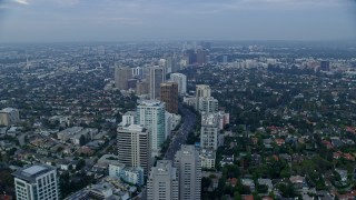 7.6K aerial stock footage following Wilshire Blvd over Los Angeles Country Club and The Windmill Links, sunrise, Century City, Beverly Hills, California Aerial Stock Footage | AX0156_138E