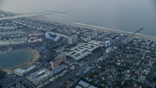 7.6K aerial stock footage flying over Venice toward Marina Del Rey condominium complexes at sunrise, California Aerial Stock Footage | AX0156_153