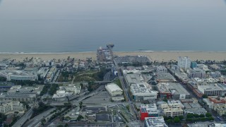 7.6K aerial stock footage of beachfront shops near Santa Monica Pier in the morning, Santa Monica, California Aerial Stock Footage | AX0156_157E