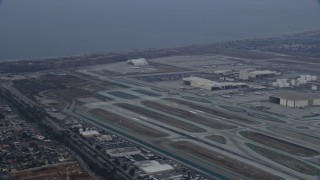 7.6K aerial stock footage tracking an airplane taking off from LAX, sunrise, Los Angeles, California Aerial Stock Footage | AX0156_184