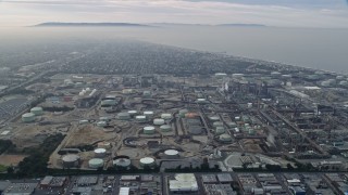 7.6K aerial stock footage of Oil Refineries on a cloudy day, El Segundo, California Aerial Stock Footage | AX0156_185