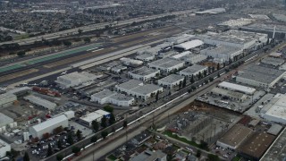 AX0156_200E - 7.6K aerial stock footage flying by Hawthorne Airport, orbit SpaceX in the morning in Hawthorne, California