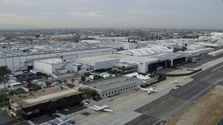 7.6K aerial stock footage flying by SpaceX HQ and the Tesla Design Center in the morning, Hawthorne, California Aerial Stock Footage | AX0156_203E