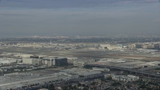 7.6K aerial stock footage approaching LAX on a cloudy day, Los Angeles, California Aerial Stock Footage | AX0157_002E