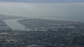 7.6K aerial stock footage of coastal community and harbors, hazy, Marina Del Rey, California Aerial Stock Footage | AX0157_011