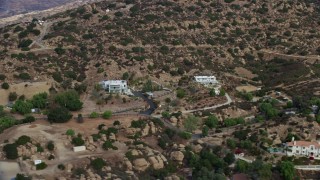 AX0157_055 - 7.6K aerial stock footage of upscale, hillside homes in Canoga Park, California