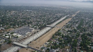 7.6K aerial stock footage flying over homes to approach the 118 Freeway in Granada Hills, California Aerial Stock Footage | AX0157_072E