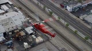 7.6K aerial stock footage tracking a Sikorsky S58T flying over Pacoima and reveal Whiteman Airport, California Aerial Stock Footage | AX0157_088