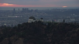 7.6K aerial stock footage of Griffith Observatory at twilight against the hills, California Aerial Stock Footage | AX0158_006