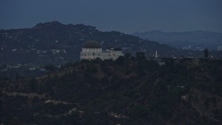 7.6K aerial stock footage tracking Griffith Observatory and reveal Hollywood Sign, twilight, Los Angeles, California Aerial Stock Footage | AX0158_007E