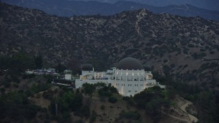 7.6K aerial stock footage of the front of Griffith Observatory at twilight, Los Angeles, California Aerial Stock Footage | AX0158_010