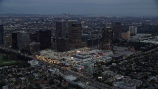 7.6K aerial stock footage orbiting Westfield shopping mall and bordering office buildings, twilight, Century City, California Aerial Stock Footage | AX0158_033