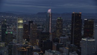 7.6K aerial stock footage of Wilshire Grand Center and nearby skyscrapers at twilight in Downtown Los Angeles, California Aerial Stock Footage | AX0158_047E