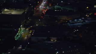 7.6K aerial stock footage of an LAPD helicopter flying over Downtown Los Angeles, California at night Aerial Stock Footage | AX0158_099