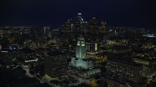 7.6K aerial stock footage of Downtown skyscrapers seen while flying by City Hall at night in Downtown Los Angeles, California Aerial Stock Footage | AX0158_109E