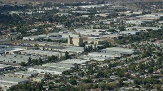 AX0159_005E - 7.6K aerial stock footage flying over warehouses in Sylmar industrial area, San Fernando Valley, California