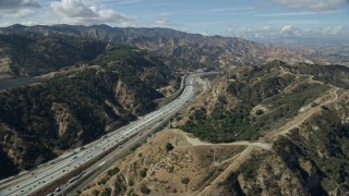 AX0159_010E - 7.6K aerial stock footage flying over I-5 with light traffic, Santa Clarita, California